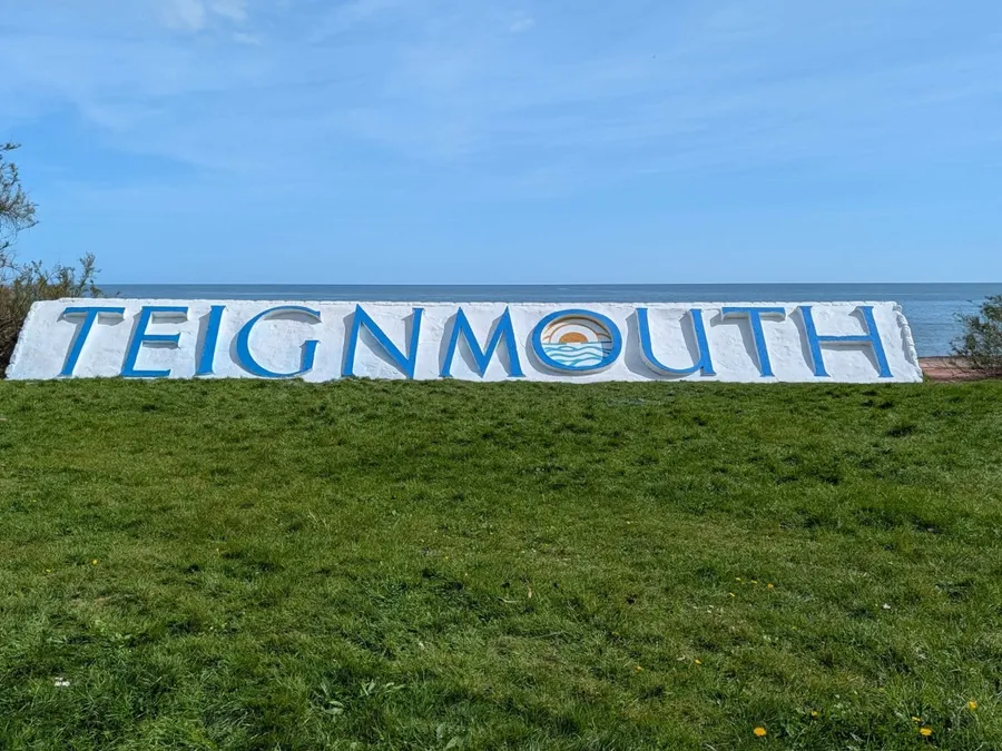 The distinctive Teignmouth town sign on the Devon coast