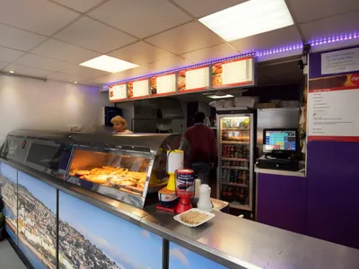Interior counter and service area at Harbour Fish Bar in Teignmouth