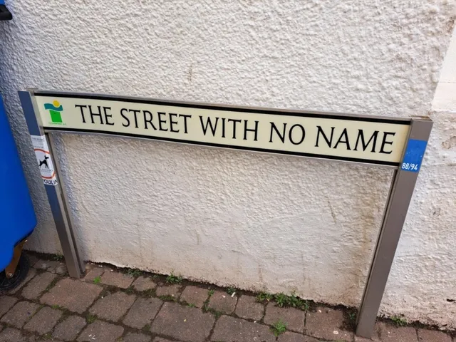 The short alley known as The Street With No Name between terraces in Teignmouth town centre